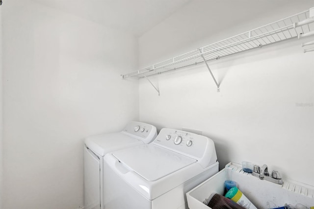 washroom featuring sink and washer and dryer