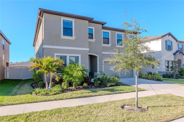 view of front of home featuring a garage and a front yard