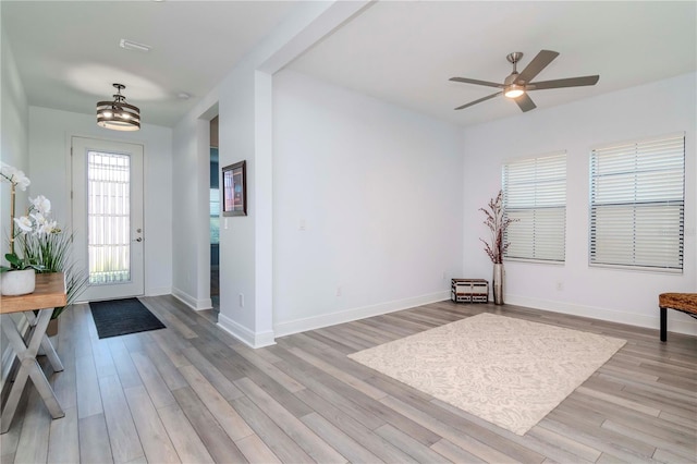 entrance foyer with ceiling fan and light wood-type flooring