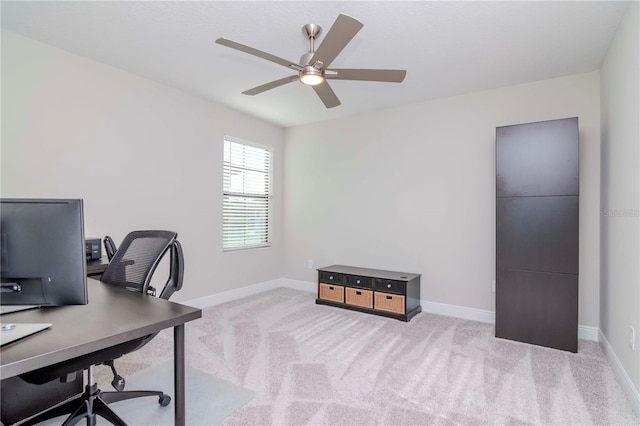 carpeted home office with ceiling fan