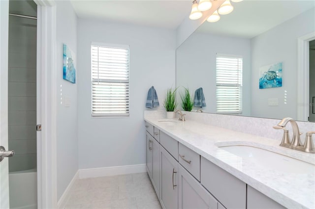 bathroom featuring vanity, a shower, and tile patterned floors