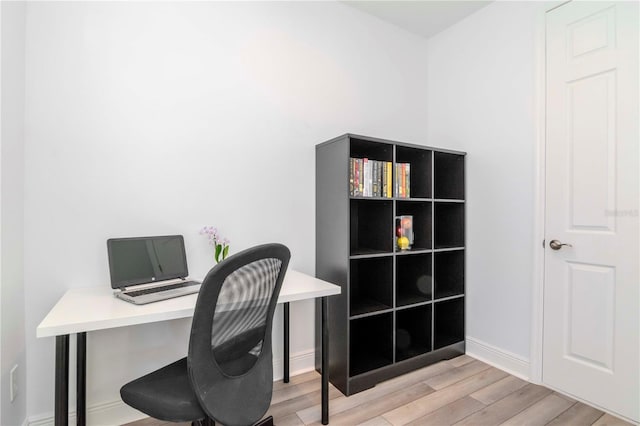 home office with light wood-type flooring