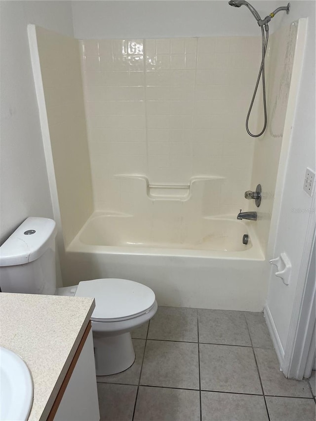 full bathroom featuring toilet, vanity, bathtub / shower combination, and tile patterned flooring