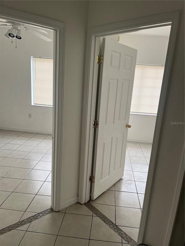 hall with light tile patterned flooring