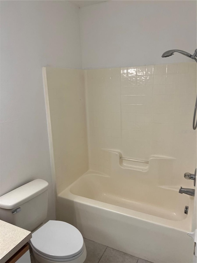 full bathroom with vanity, tile patterned floors, toilet, and washtub / shower combination