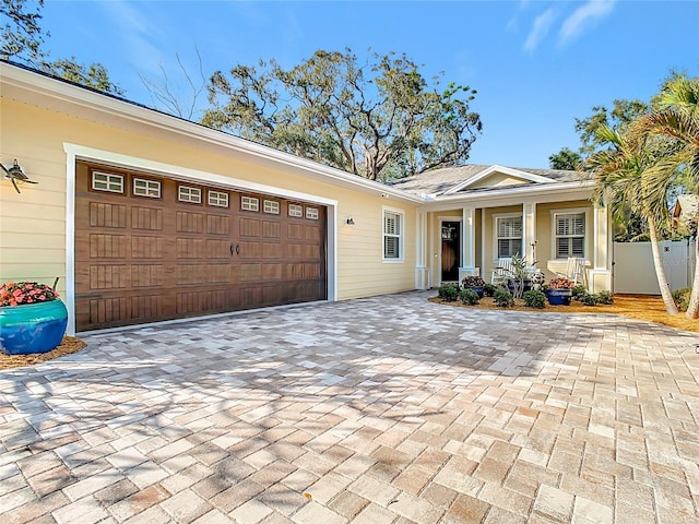 view of front of home featuring a garage and a porch