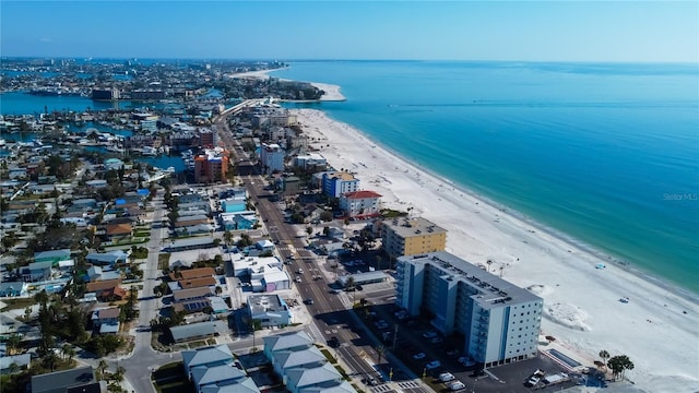 birds eye view of property with a view of the beach and a water view