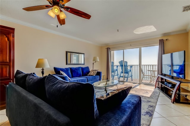 tiled living room with crown molding and ceiling fan