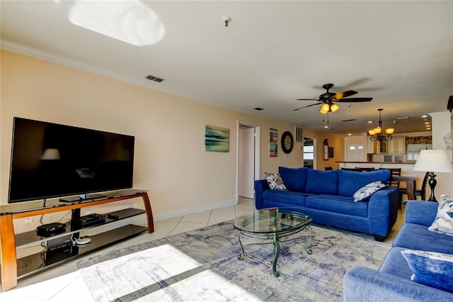 tiled living room with ornamental molding and ceiling fan with notable chandelier