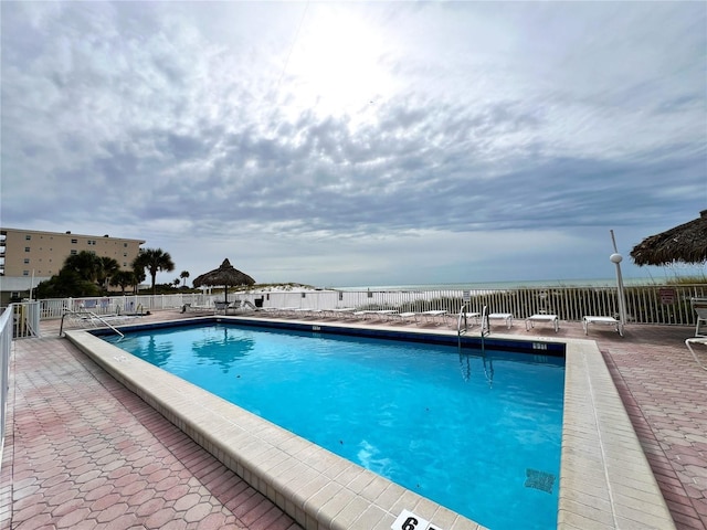 view of pool featuring a patio