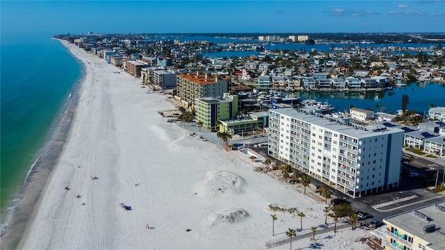 drone / aerial view with a water view and a view of the beach