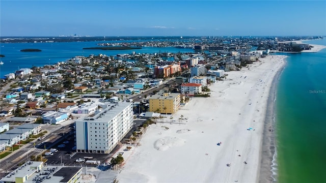 drone / aerial view with a water view and a view of the beach