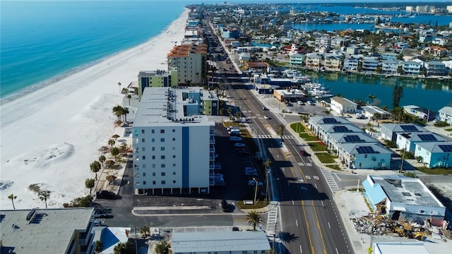 drone / aerial view featuring a view of the beach and a water view