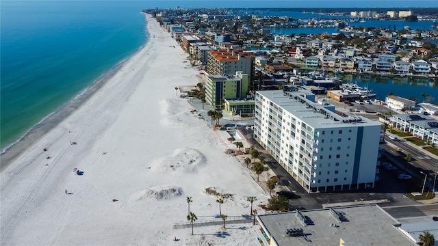 bird's eye view with a water view and a beach view