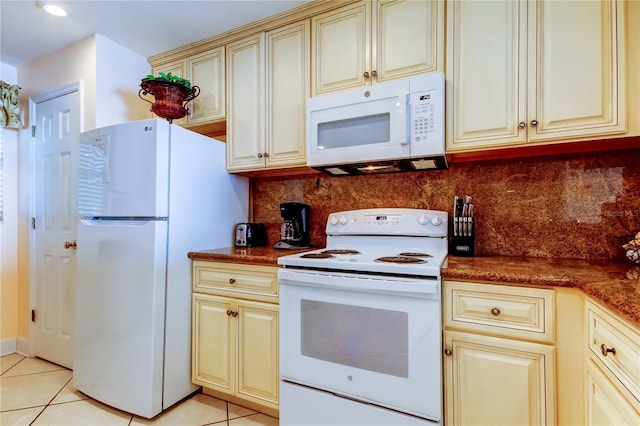 kitchen with backsplash, white appliances, cream cabinetry, and light tile patterned flooring