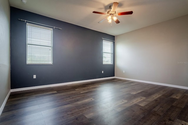 empty room featuring dark hardwood / wood-style floors and ceiling fan