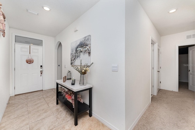 foyer with light tile patterned floors