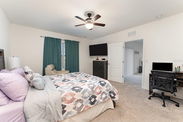 carpeted bedroom with vaulted ceiling and ceiling fan