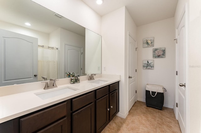 bathroom with vanity, tile patterned floors, and walk in shower