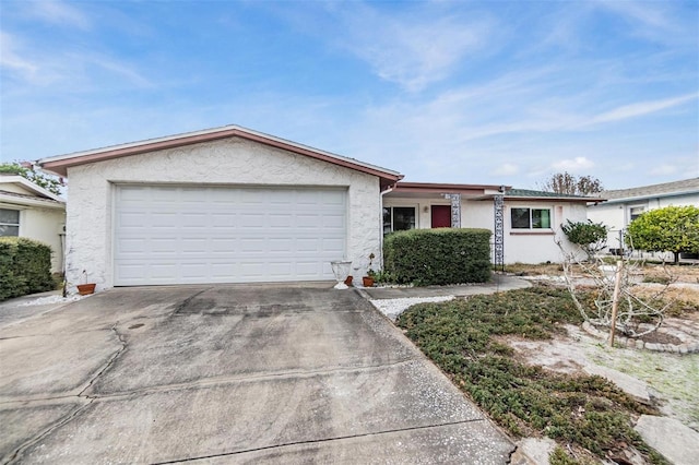 single story home with a garage