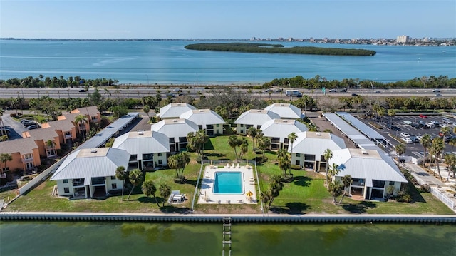 birds eye view of property with a water view