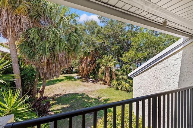 view of yard with a balcony