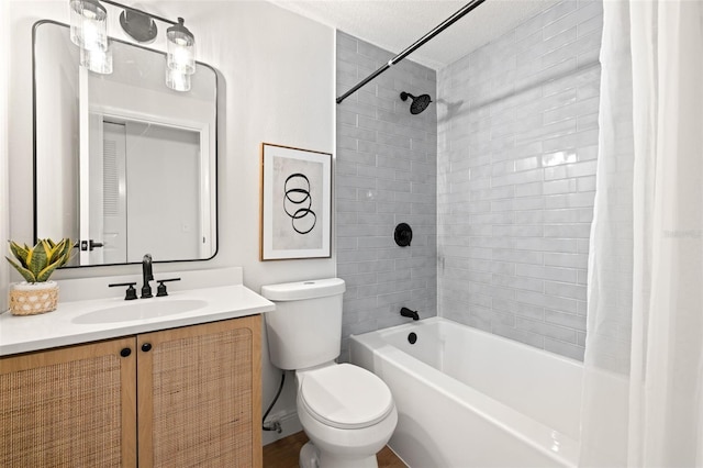 full bathroom featuring shower / bath combination with curtain, vanity, and toilet