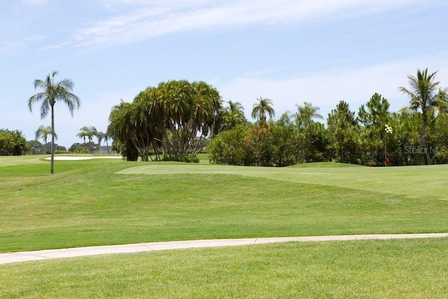 view of home's community featuring a lawn