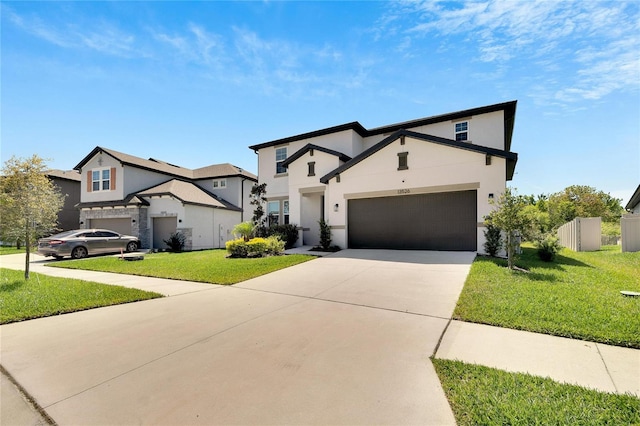 view of front of house with a garage and a front yard