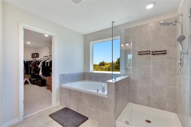 bathroom featuring tile patterned floors and plus walk in shower