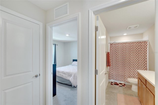 bathroom with vanity, a shower with curtain, and toilet