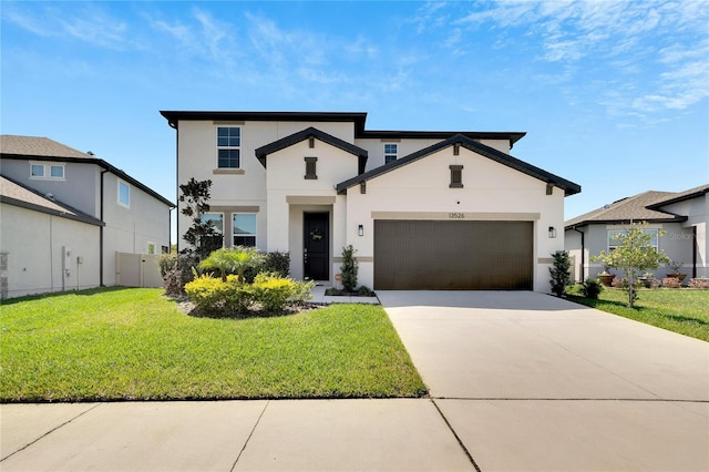 view of front of home featuring a garage and a front lawn