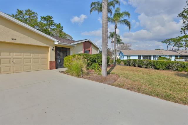 view of front of house featuring a garage and a front yard