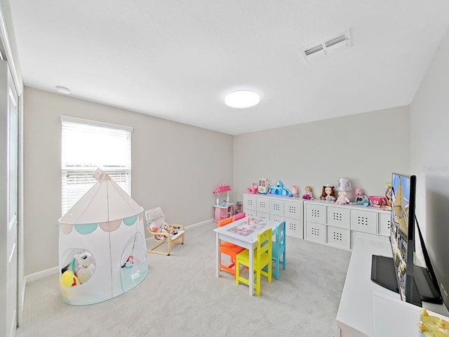 playroom featuring light colored carpet