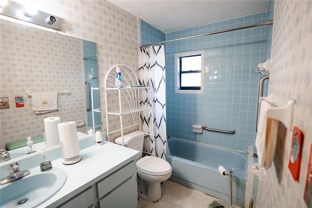 full bathroom featuring shower / tub combo with curtain, vanity, toilet, tile patterned floors, and a textured ceiling