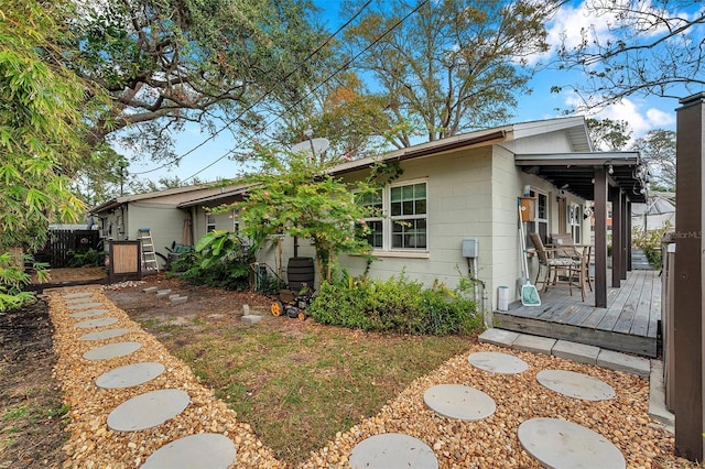 view of front of house with a wooden deck