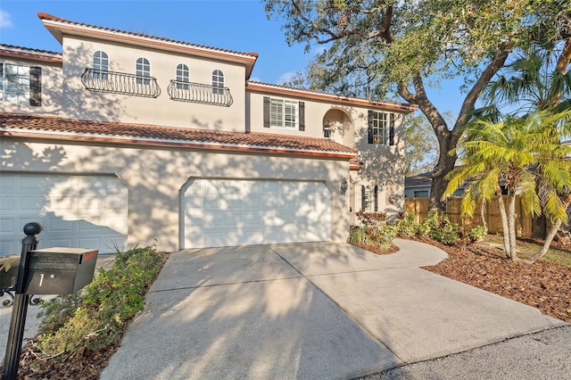 mediterranean / spanish house with a garage