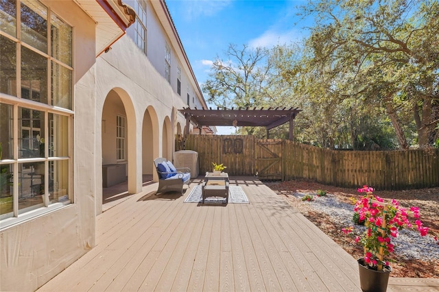 deck featuring a pergola and outdoor lounge area