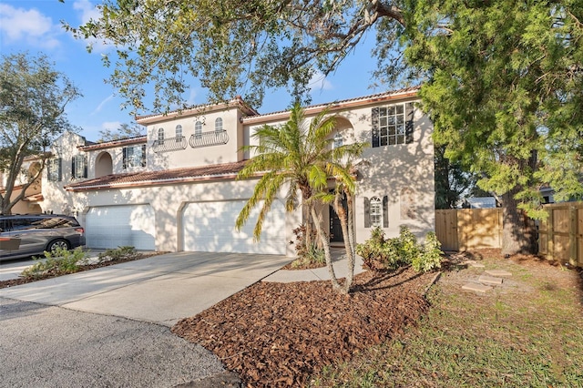 mediterranean / spanish home with a garage