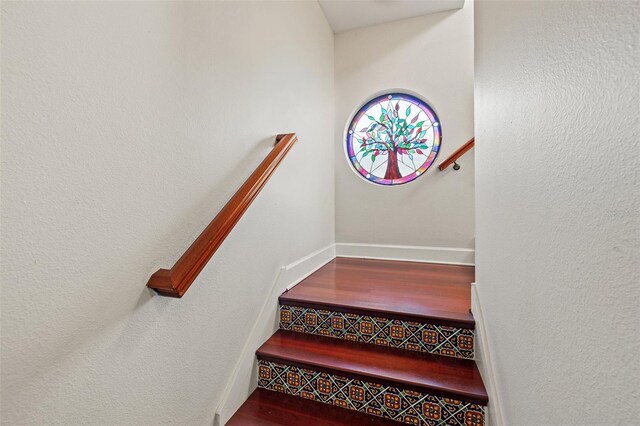 staircase featuring hardwood / wood-style floors