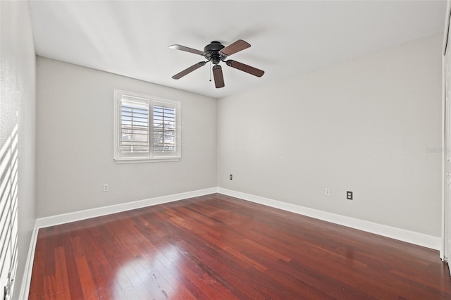 empty room featuring dark hardwood / wood-style floors and ceiling fan