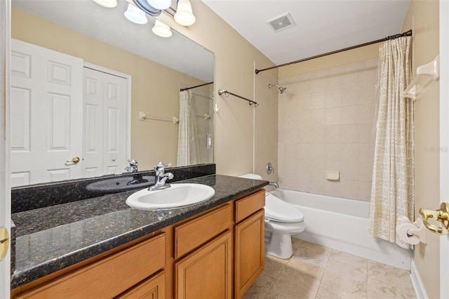 full bathroom featuring shower / tub combo with curtain, vanity, toilet, and tile patterned floors