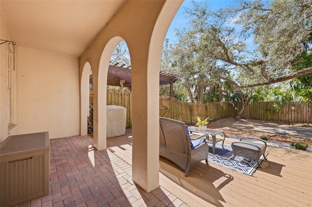 view of patio with outdoor lounge area, heating unit, and a pergola