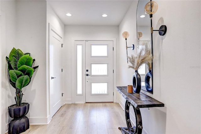 entryway with light hardwood / wood-style floors