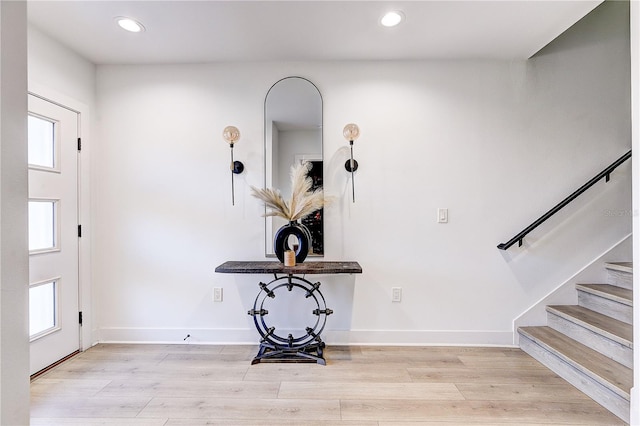 entrance foyer featuring a wealth of natural light and light wood-type flooring