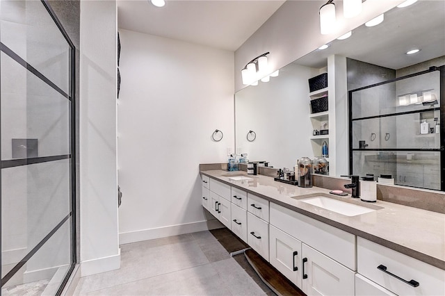 bathroom featuring tile patterned flooring, vanity, and a shower with shower door