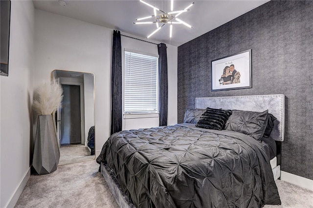 carpeted bedroom with a chandelier