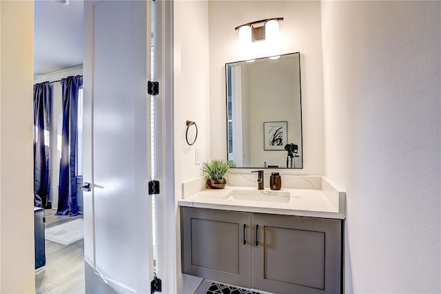 bathroom featuring vanity and hardwood / wood-style floors