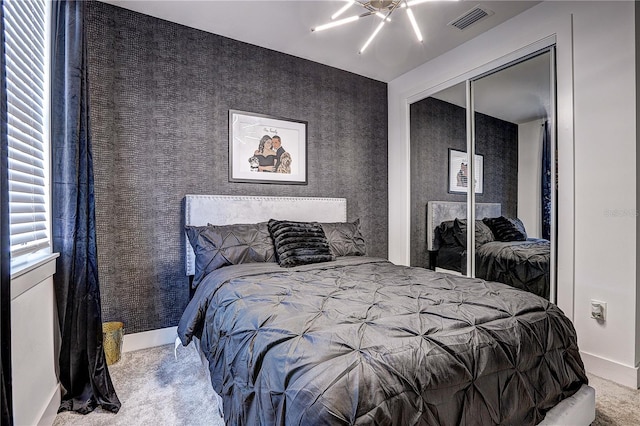 carpeted bedroom with a closet