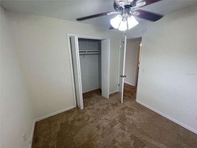 unfurnished bedroom with a closet, ceiling fan, and carpet flooring